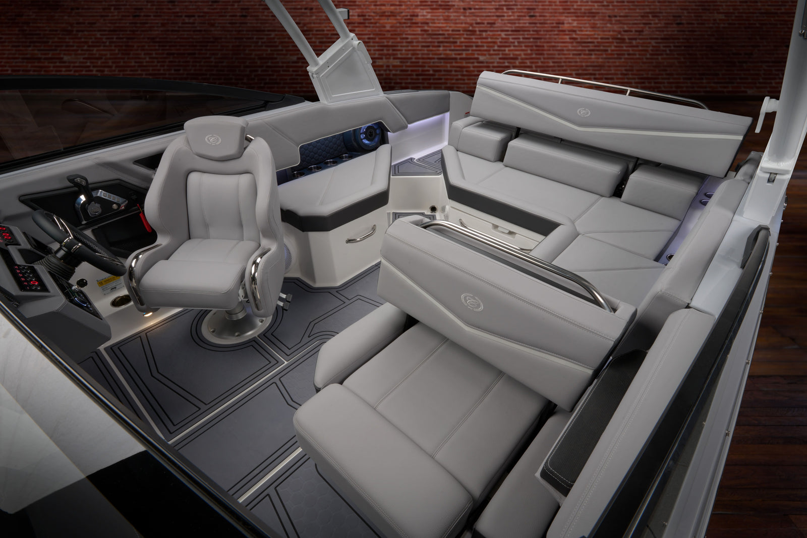 Interior of a boat with gray seats and dashboard