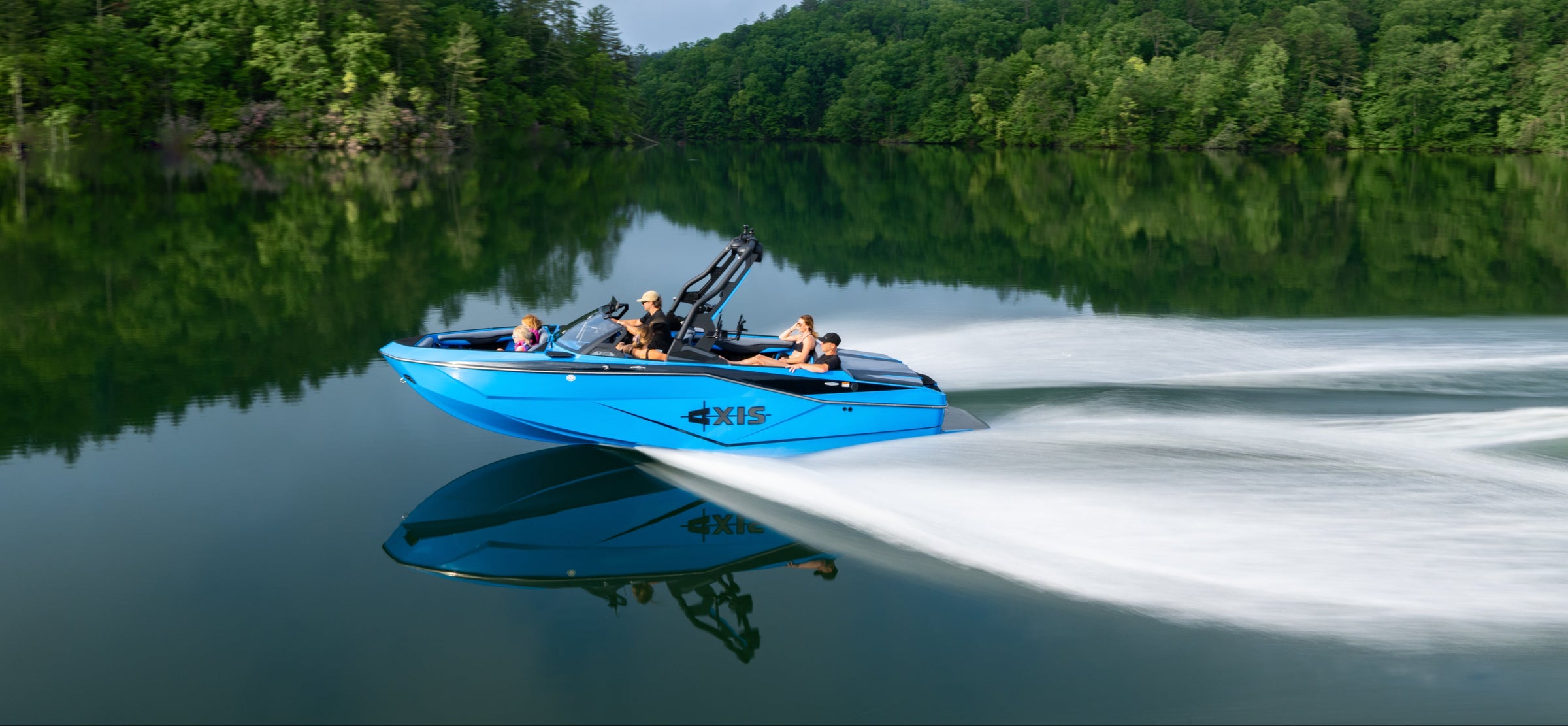 Blue jet ski on a lake with trees in the background