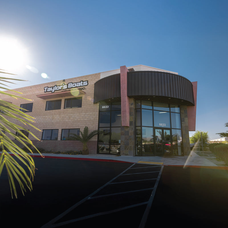 Taylor's Boats Nevada dealership building exterior under clear blue sky